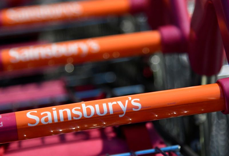 © Reuters. FILE PHOTO: Branding is seen on a shopping trolley at a branch of the Sainsbury's supermarket in London, Britain, January 7, 2022. REUTERS/Toby Melville/File Photo