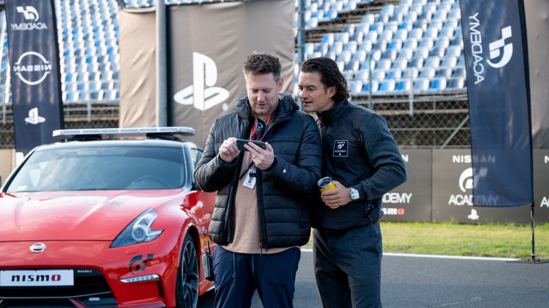 &copy; Reuters. FILE PHOTO: Director Neill Blomkamp and Orlando Bloom are seen on the set of Columbia Pictures 'Gran Turismo' at an unspecified location in this undated handout image.  Sony is teasing the film at the CES 2023 technology trade show this week. Gordon Timpe