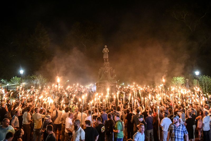 &copy; Reuters. FILE PHOTO: White nationalists participate in a torch-lit march on the grounds of the University of Virginia ahead of the Unite the Right Rally in Charlottesville, Virginia on August 11, 2017. REUTERS/Stephanie Keith