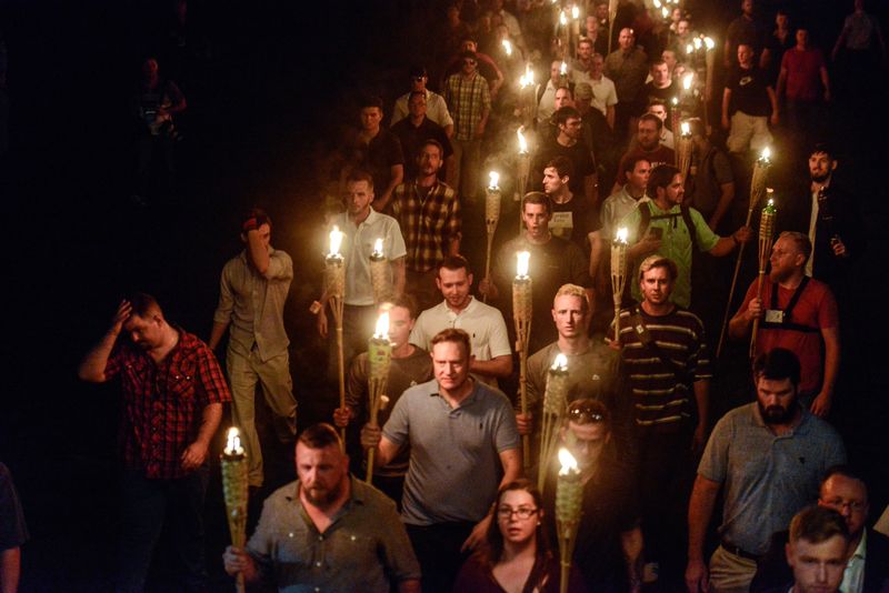 © Reuters. FILE PHOTO: White nationalists participate in a torch-lit march on the grounds of the University of Virginia ahead of the Unite the Right Rally in Charlottesville, Virginia on August 11, 2017. Picture taken August 11, 2017.   REUTERS/Stephanie Keith