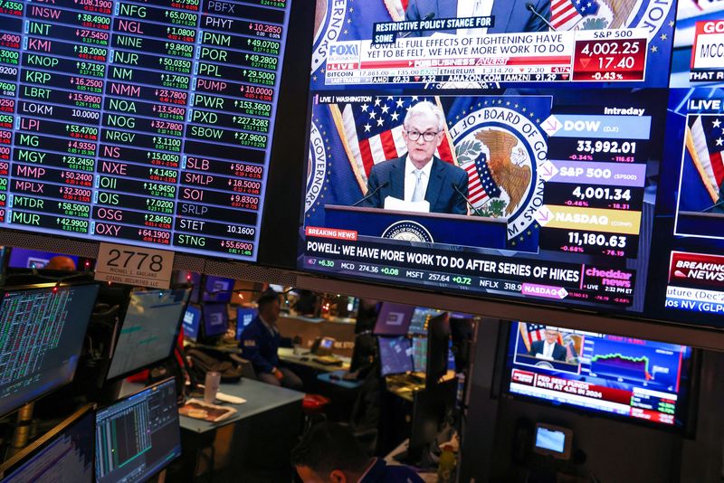 &copy; Reuters. Screens on the trading floor at New York Stock Exchange (NYSE) display the Federal Reserve Chair Jerome Powell during a news conference after the Federal Reserve announced interest rates will raise half a percentage point, in New York City, U.S., December