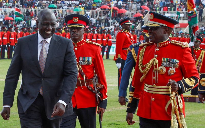 &copy; Reuters. FILE PHOTO: Kenya's President William Ruto is escorted by Robert Kibochi, Chief of Kenya Defence Forces, after inspecting a guard of honour by the Kenya Defence Forces during the country's 59th Jamhuri Day or Independence Day celebrations at the Nyayo Nat
