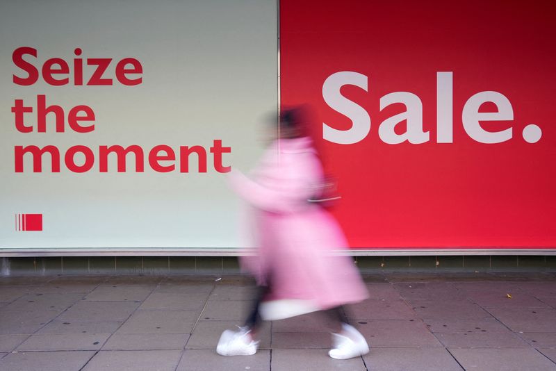 &copy; Reuters. FILE PHOTO: A person walks along a shopping street, during the traditional Boxing Day sales in London, Britain, December 26, 2022. REUTERS/Maja Smiejkowska