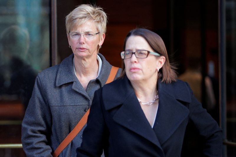&copy; Reuters. FILE PHOTO: Donna Heinel (L), former associate athletic director at the University of Southern California (USC) facing charges in a nationwide college admissions cheating scheme, leaves the federal courthouse in Boston, Massachusetts, U.S., March 25, 2019