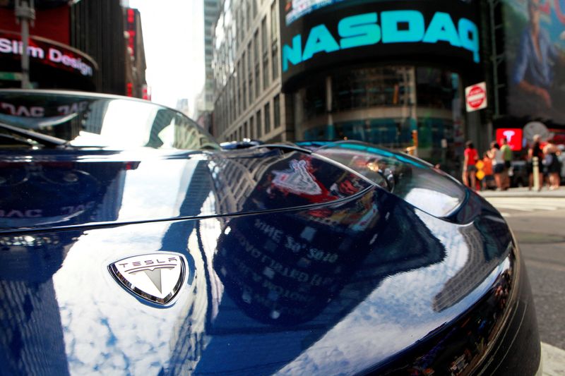 &copy; Reuters. FILE PHOTO: A Tesla Roadster is parked in New York's Times Square following Tesla Motors Inc's initial public offering at the NASDAQ market in New York, June 29, 2010. REUTERS/Brendan McDermid/File Photo