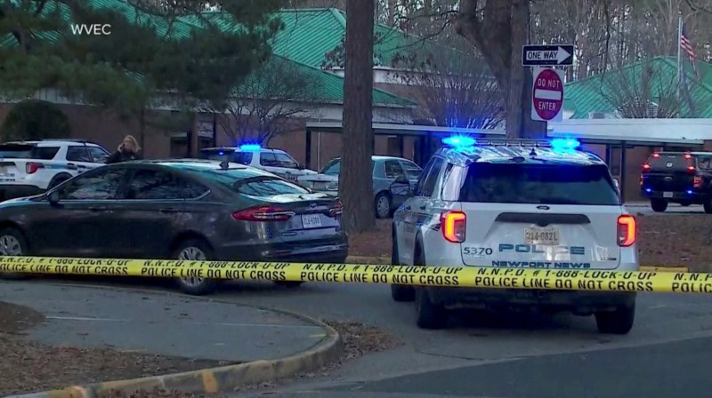 &copy; Reuters. FILE PHOTO: Police vehicles are seen parked outside Richneck Elementary School, where according to the police, a six-year-old boy shot and wounded a teacher, in Newport News, Virginia, U.S., January 6, 2023, in this screen grab from a handout video. WVEC 