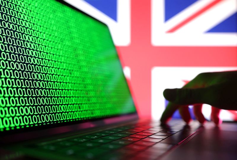 &copy; Reuters. Illustration shows a laptop with binary codes displayed in front of the UK flag in this illustration taken, August 19, 2022. REUTERS/Dado Ruvic/Illustration/Files