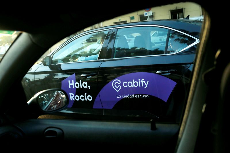 &copy; Reuters. FILE PHOTO: A Cabify taxi car is seen through the window of a car in Malaga, southern Spain August 3, 2018. REUTERS/Jon Nazca/File Photo