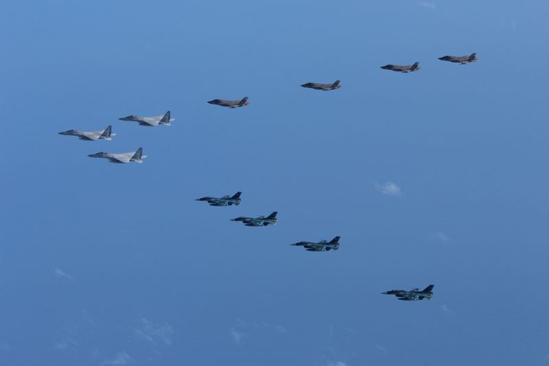 &copy; Reuters. FILE PHOTO: 5th and 8th Air Wing of Japan Air Self-Defense Force's F-15 and F-2 fighters hold a joint military drill with U.S. Marine Aircraft Group 12's F-35B fighters off Japan's southernmost main island of Kyushu, Japan, in this handout picture taken b