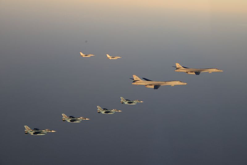 © Reuters. FILE PHOTO: The 8th Air Wing of Japan Air Self-Defense Force's F-2 fighters hold a joint military drill with the U.S. 28th Bomb Wing's B-1B bombers and 35th Fighter Wing's F-16 fighters off Japan's southernmost main island of Kyushu, Japan, in this handout picture taken by Japan Air Self-Defence Force and released by the Joint Staff Office of the Defense Ministry of Japan November 5, 2022. Joint Staff Office of the Defense Ministry of Japan/HANDOUT via REUTERS 