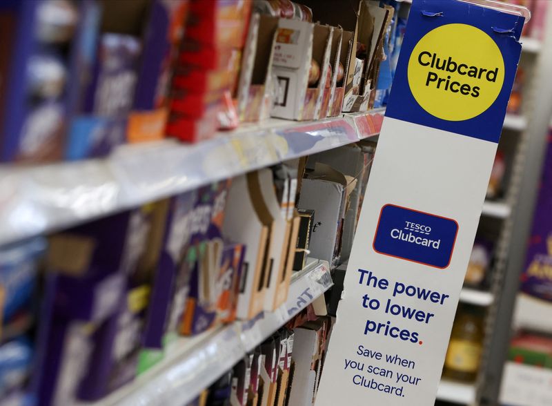 © Reuters. FILE PHOTO: Clubcard branding is seen inside a branch of a Tesco Extra Supermarket in London, Britain, February 10, 2022. Picture taken February 10, 2022. REUTERS/Paul Childs/File Photo