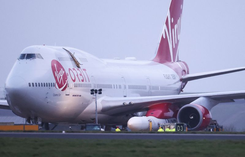 &copy; Reuters. Cosmic Girl, a Virgin Boeing 747-400 aircraft sits on the tarmac with Virgin Orbit's LauncherOne rocket attached to the wing, ahead of the first UK launch tonight, at Spaceport Cornwall at Newquay Airport in Newquay, Britain, January 9, 2023. REUTERS/Henr