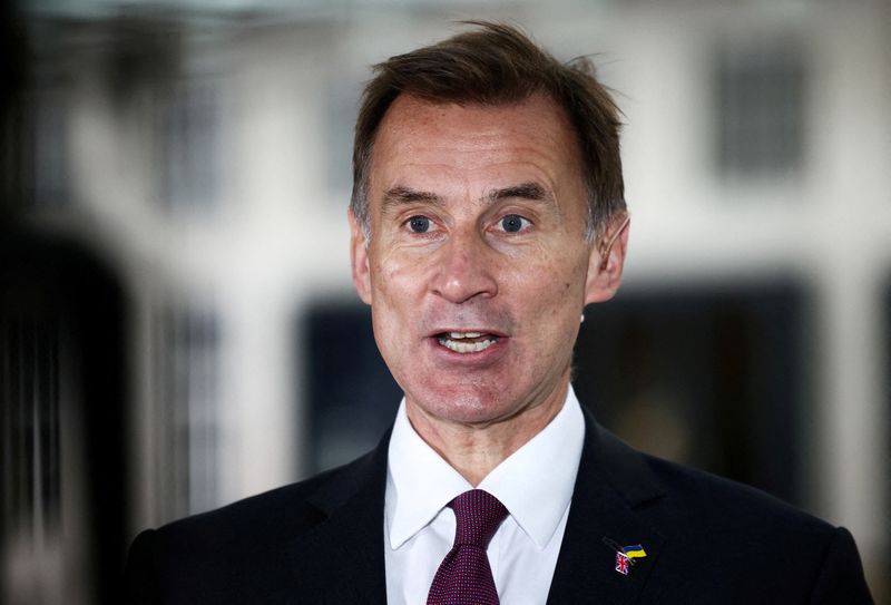 &copy; Reuters. FILE PHOTO: British Chancellor of the Exchequer Jeremy Hunt talks to a television crew outside the BBC headquarters in London, Britain November 18, 2022. REUTERS/Henry Nicholls