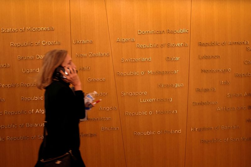 &copy; Reuters. FILE PHOTO: An attendee navigates the headquarters of the International Monetary Fund during the group's Annual Meetings in Washington, U.S., October 13, 2022. REUTERS/James Lawler Duggan/File Photo