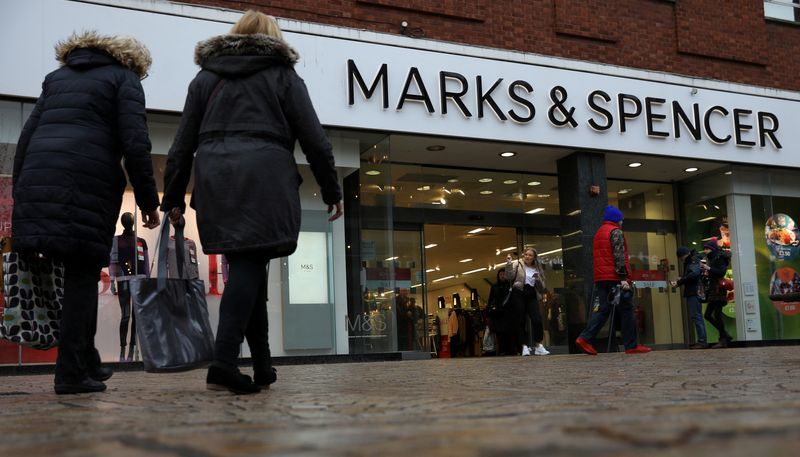 &copy; Reuters. FILE PHOTO: Shoppers walk past a branch of Marks and Spencer in Altrincham, Britain January 7 2020. REUTERS/Phil Noble/File Photo