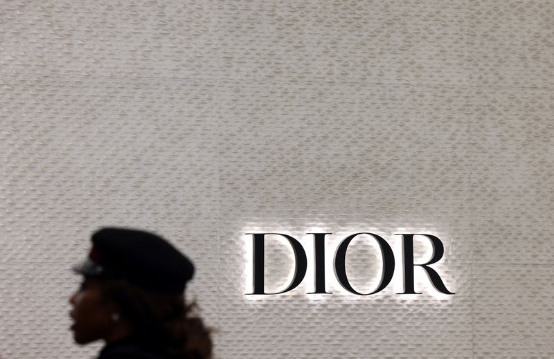 &copy; Reuters. FILE PHOTO: A woman walks in front of the Dior branded shop inside the department store Kaufhaus des Westens "KaDeWe" during the 115 years celebration in Berlin, Germany November 16, 2022. REUTERS/Lisi Niesner