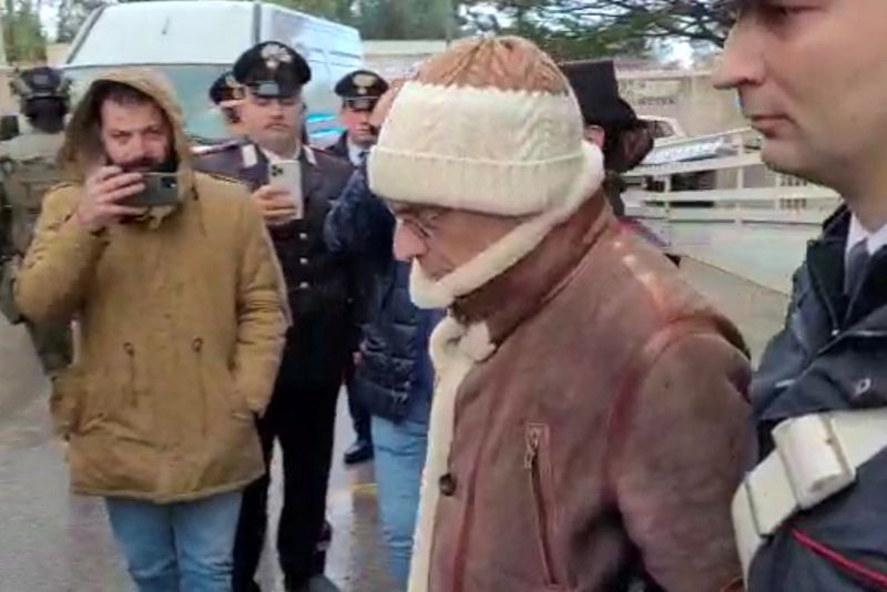 &copy; Reuters. FILE PHOTO: A screengrab taken from a video shows Matteo Messina Denaro the country's most wanted mafia boss being escorted out of a Carabinieri police station after he was arrested in Palermo, Italy, January 16, 2023. Carabinieri/Handout via REUTERS 