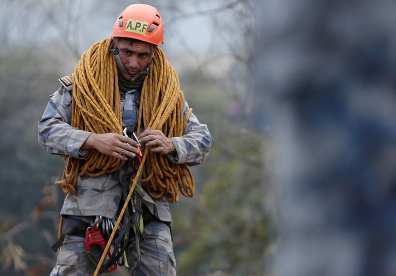 Nepal plane crash searchers rappel, fly drones in last-ditch effort to find two people