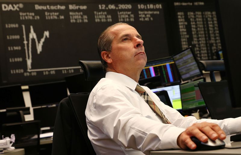 &copy; Reuters. FILE PHOTO-A trader looks at his screens during a trading session at Frankfurt's Stock Exchange, as markets react on the coronavirus disease (COVID-19), Germany, June 12, 2020.   REUTERS/Kai Pfaffenbach