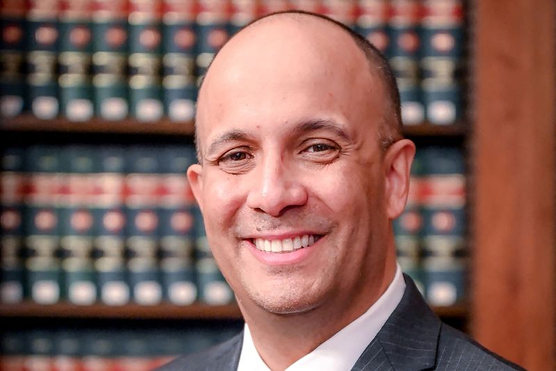 © Reuters. Justice Hector D. LaSalle, Presiding Justice, Appellate Division Second Department, poses in his chambers in an undated photograph. David Handschuh/UCS/Handout via REUTERS