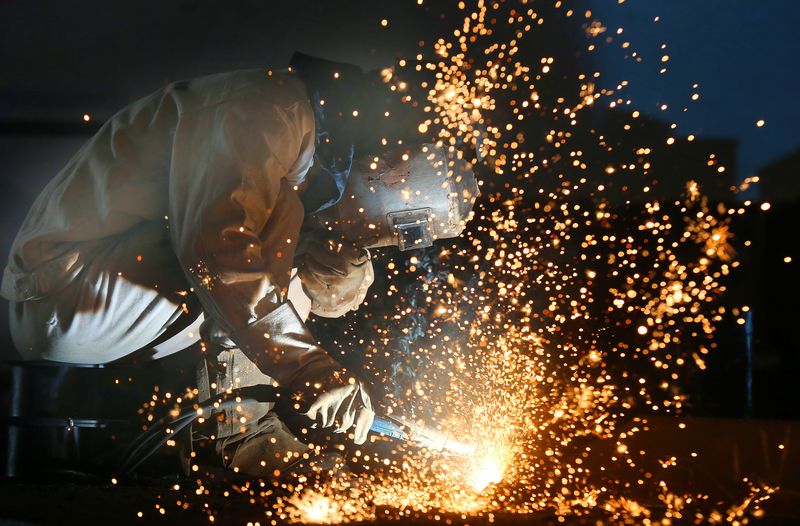 &copy; Reuters. FILE PHOTO: A worker works on a production line at a factory of a ship equipments manufacturer, in Nantong, Jiangsu province, China March 2, 2020. Picture taken March 2, 2020. China Daily via REUTERS