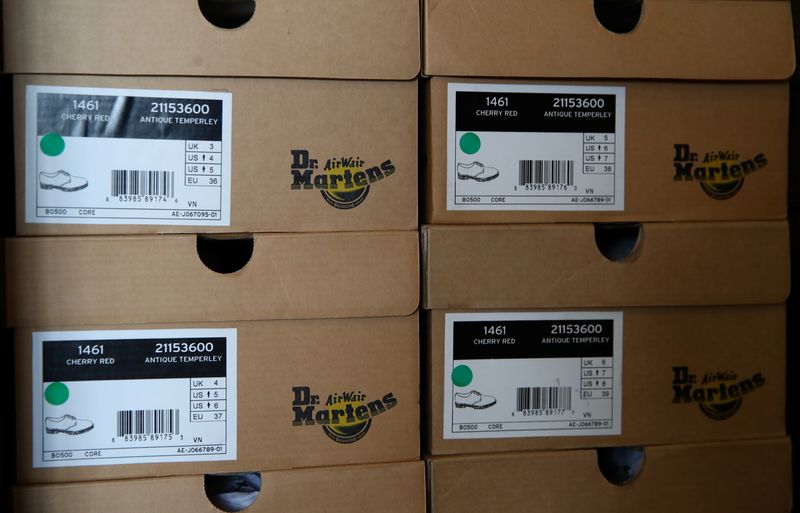 &copy; Reuters. FILE PHOTO: Boxes of Dr. Martens shoes are pictured in the warehouse of local footwear retailer "Pomp It Up" in Bussigny near Lausanne, Switzerland 24 Aprill, 2019. REUTERS/Denis Balibouse