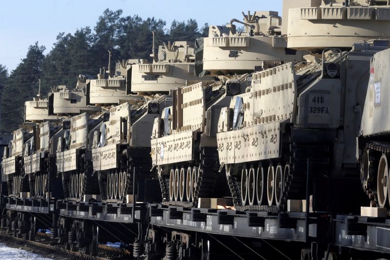 &copy; Reuters. FILE PHOTO: U.S. Bradley fighting vehicles that will be deployed in Latvia for NATO's Operation Atlantic Resolve wait for an unload in Garkalne, Latvia February 8, 2017.  REUTERS/Ints Kalnins/File Photo