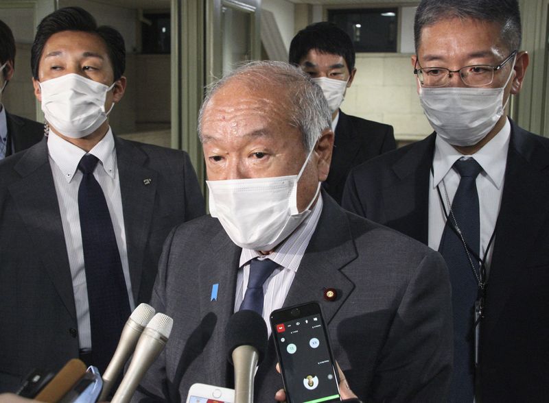 &copy; Reuters. FILE PHOTO: Japan's Finance Minister Shunichi Suzuki speaks to media at Finance Ministry in Tokyo, Japan October 20, 2022, in this photo taken by Kyodo. Kyodo/via REUTERS 