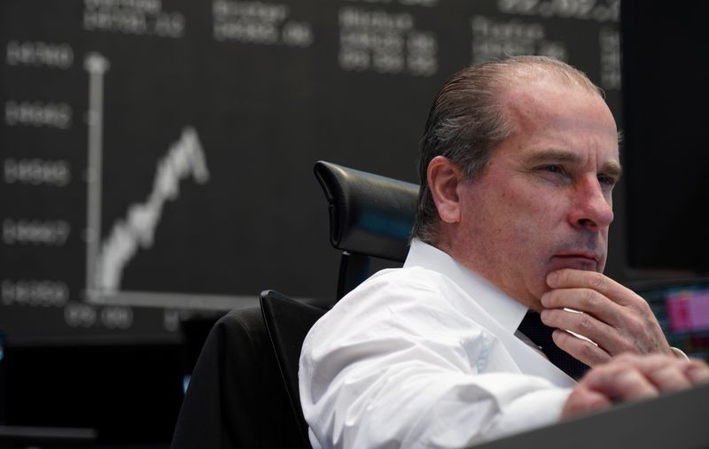 &copy; Reuters. A trader works at the Frankfurt stock exchange in Frankfurt, Germany, February 22, 2022.    REUTERS/Timm Reichert