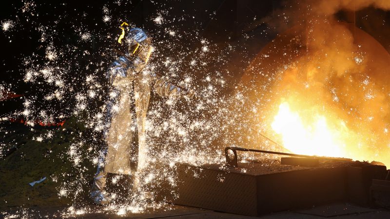 &copy; Reuters. A steel worker of ThyssenKrupp stands amid sparks of raw iron coming from a blast furnace at a ThyssenKrupp steel factory in Duisburg, western Germany, November 14, 2022. REUTERS/Wolfgang Rattay