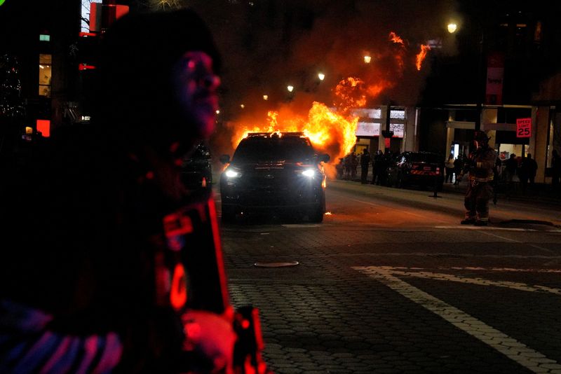 &copy; Reuters. A law enforcement vehicle is seen lit on fire during demonstrations related to the death of Manuel Teran who was killed during a police raid inside Weelaunee People's Park, the planned site of a controversial "Cop City" project, in Atlanta, Georgia, U.S.,