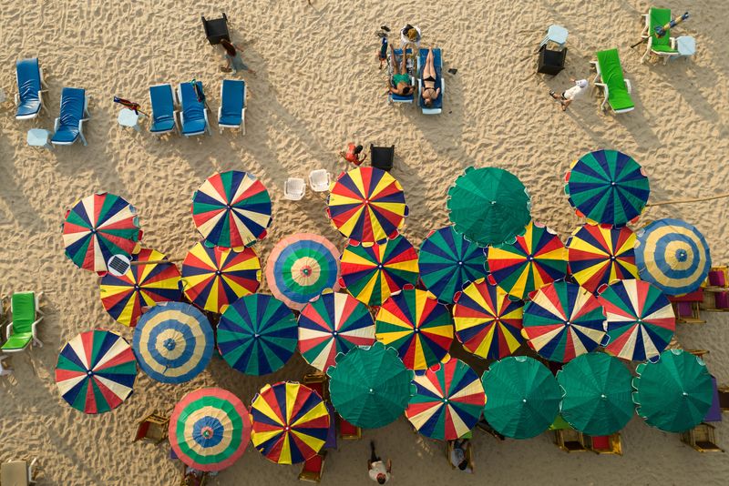 &copy; Reuters. Colorful umbrellas are seen in a restaurant as tourists enjoy a beach in the island of Phuket in Thailand January 19, 2023. REUTERS/Jorge Silva
