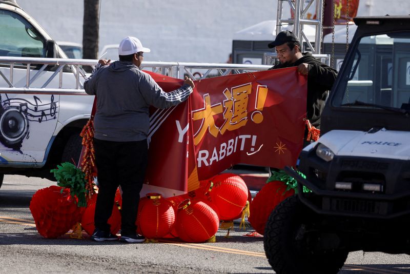 &copy; Reuters. Workers take down a Chinese Lunar New Year celebration banner near the location of a shooting that took place during a Chinese Lunar New Year celebration, in Monterey Park, California, U.S. January 22, 2023. REUTERS/Mike Blake