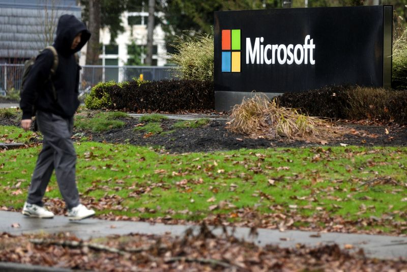 &copy; Reuters. A person walks past Microsoft signage at the headquarters in Redmond, Washington, U.S., January 18, 2023. REUTERS/Matt Mills McKnight