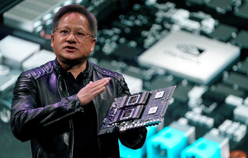 &copy; Reuters. FILE PHOTO: Jensen Huang, CEO of Nvidia, shows the Drive Pegasus robotaxi AI computer at his keynote address at CES in Las Vegas, Nevada, U.S. January 7, 2018. REUTERS/Rick Wilking/File Photo