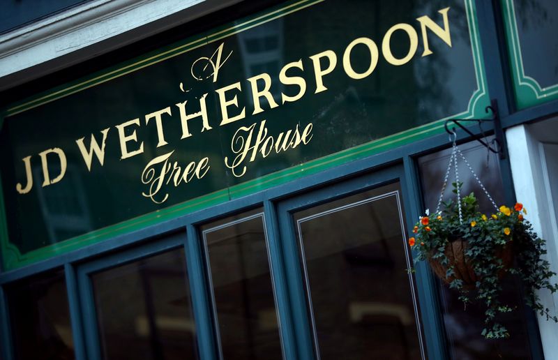 © Reuters. FILE PHOTO: A Wetherspoon's logo is seen at a pub in central London, Britain January 23, 2019. REUTERS/Hannah McKay/File Photo