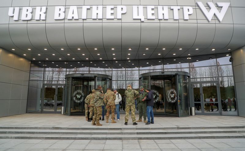 &copy; Reuters. FILE PHOTO: Visitors gather outside PMC Wagner Centre, which is a project implemented by the businessman and founder of the Wagner private military group Yevgeny Prigozhin, during the official opening of the office block in Saint Petersburg, Russia, Novem