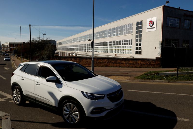 &copy; Reuters. FILE PHOTO: A car is seen in front of the Vauxhall Manufacturing plant in Luton, Britain, on  March 16, 2020. REUTERS/John Sibley