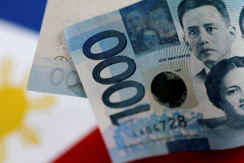 &copy; Reuters. FILE PHOTO: A Philippines Peso note is seen in this picture illustration June 2, 2017. REUTERS/Thomas White/Illustration