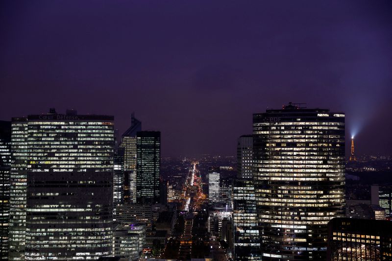 &copy; Reuters. FILE PHOTO: Office lights are illuminated at dusk in high rise buildings at La Defense business and financial district near Paris, France, December 5, 2022. REUTERS/Pascal Rossignol
