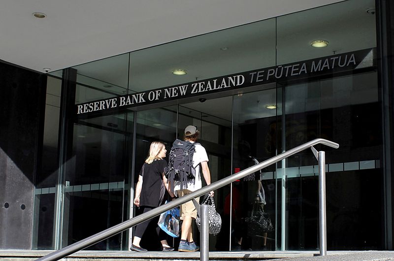 &copy; Reuters. FILE PHOTO: Two people walk towards the entrance of the Reserve Bank of New Zealand located in Wellington, New Zealand, on March 22, 2016. REUTERS/Rebecca Howard/File Photo