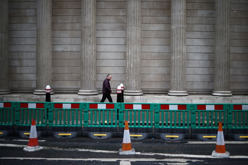 &copy; Reuters. FILE PHOTO: A person walks past the Bank of England in the City of London financial district, in London, Britain, January 26, 2023. REUTERS/Henry Nicholls