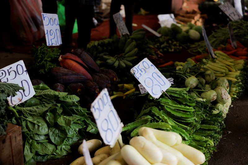 &copy; Reuters. FILE PHOTO: Price boards are placed on vegetables at a stall in the main market as Sri Lankan President Ranil Wickremesinghe announced 2023 budget amid the country's economic crisis, in Colombo, Sri Lanka, November 14, 2022. REUTERS/ Dinuka Liyanawatte