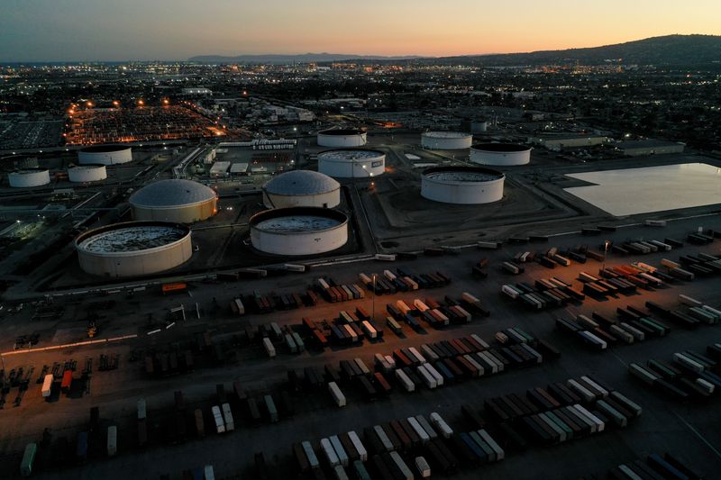 &copy; Reuters. FILE PHOTO: Cargo shipping containers, surrounded by storage tanks for refined petroleum products, are seen at Marathon Petroleum's Los Angeles Refinery, in Carson, California, U.S., March 11, 2022. Picture taken March 11, 2022.  Picture taken with a dron