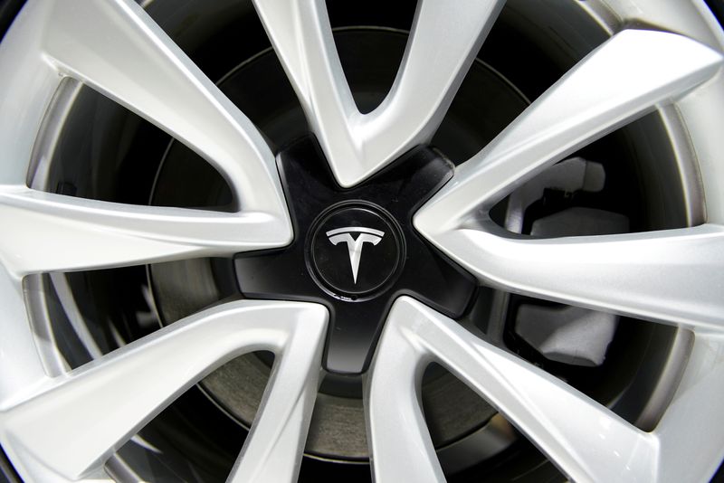 &copy; Reuters. FILE PHOTO: A Tesla logo is seen on a wheel rim during the media day for the Shanghai auto show in Shanghai, China April 16, 2019. REUTERS/Aly Song