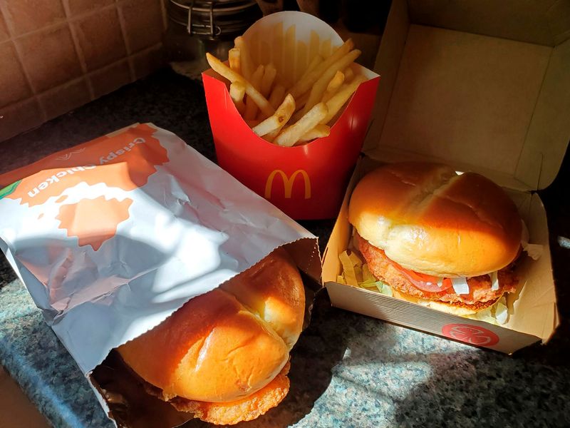 © Reuters. FILE PHOTO: McDonald's Crispy Chicken Sandwiches and fries are pictured in New York, U.S. March 30, 2021. Picture taken March 30, 2021. REUTERS/Hilary Russ