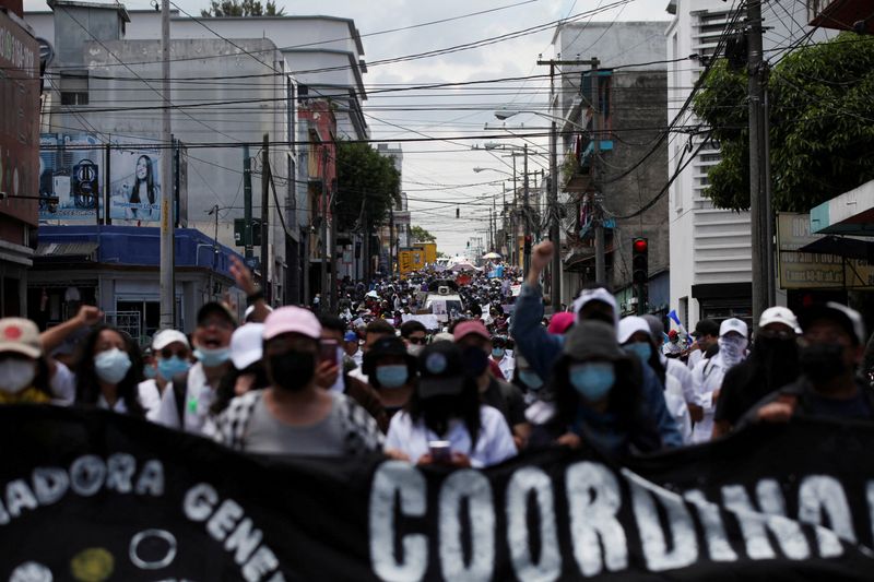&copy; Reuters. FILE PHOTO: Demonstrators march toward the Congress during a protest against what demonstrators allege is corruption in the government, in Guatemala City, Guatemala August 11, 2022. REUTERS/Sandra Sebastian
