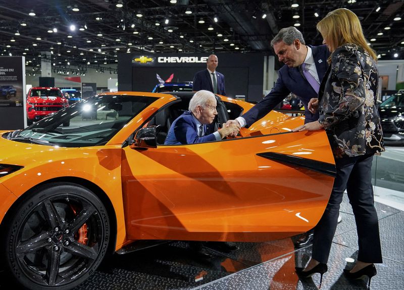 &copy; Reuters. FILE PHOTO: U.S. President Joe Biden is helped out of a Chevrolet Corvette Z06 by General Motors President Mark Reuss as GM CEO Mary Barra looks on during a visit to the Detroit Auto Show to highlight electric vehicle manufacturing in America, in Detroit,