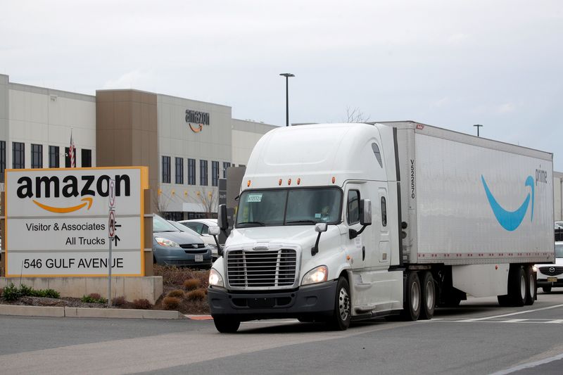 &copy; Reuters. FILE PHOTO: An Amazon truck exits the company's JFK8 distribution center in Staten Island, New York, U.S. November 25, 2020.  REUTERS/Brendan McDermid./File Photo