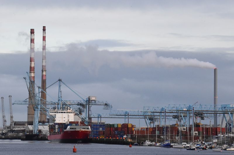 &copy; Reuters. FILE PHOTO-A cargo ship loading containers is seen at Dublin Port beside Poolbeg Generating Station owned by the Electricity Supply Board, in Dublin, Ireland, February 11, 2022. REUTERS/Clodagh Kilcoyne